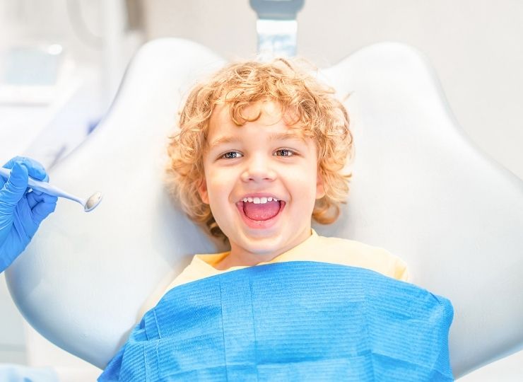 child-smiling-dental-exam