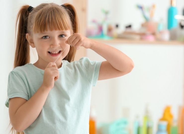girl-flossing-teeth